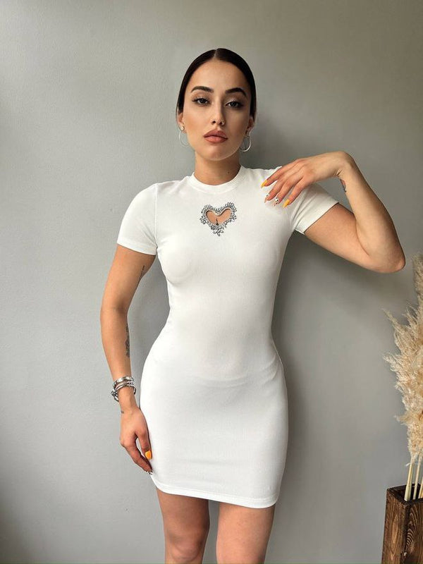"Elegant white dress featuring a sweetheart neckline that adds a soft, feminine touch."