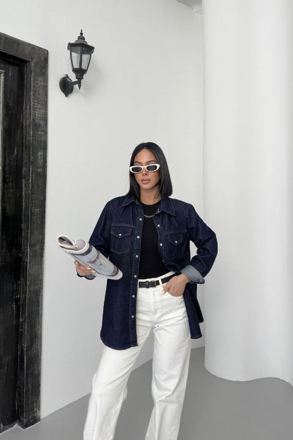 "A classic blue denim shirt with a button-down front, chest pockets, and a relaxed fit. Perfect for casual or layered looks."