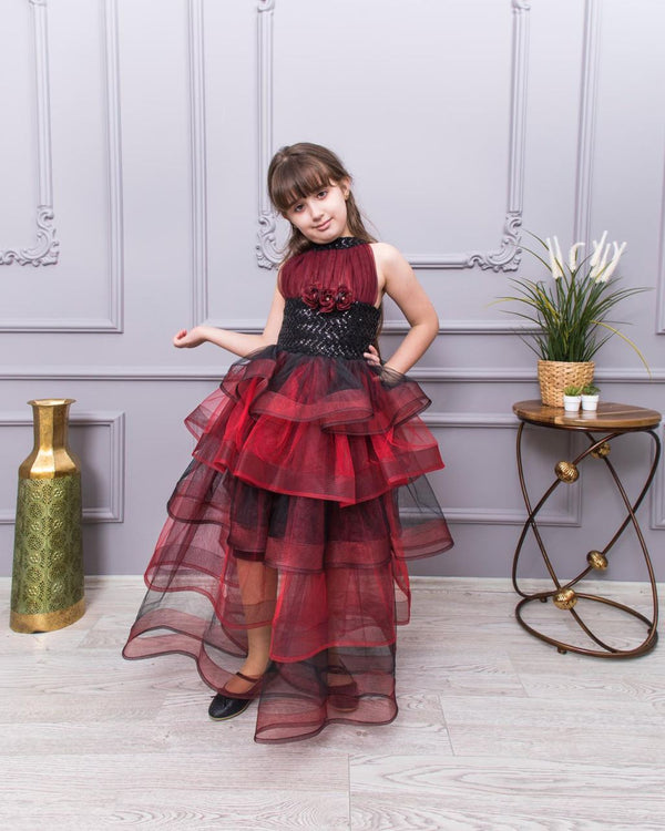 "A lovely long dress for kids, made from soft, breathable fabric. It features a comfortable fit with pretty details, perfect for parties or casual outings."