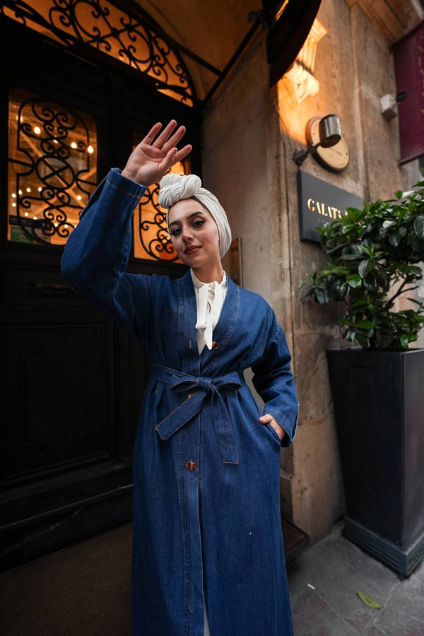 "A stylish long denim dress with a button-down front, long sleeves, and a flattering waist belt—perfect for casual everyday wear."