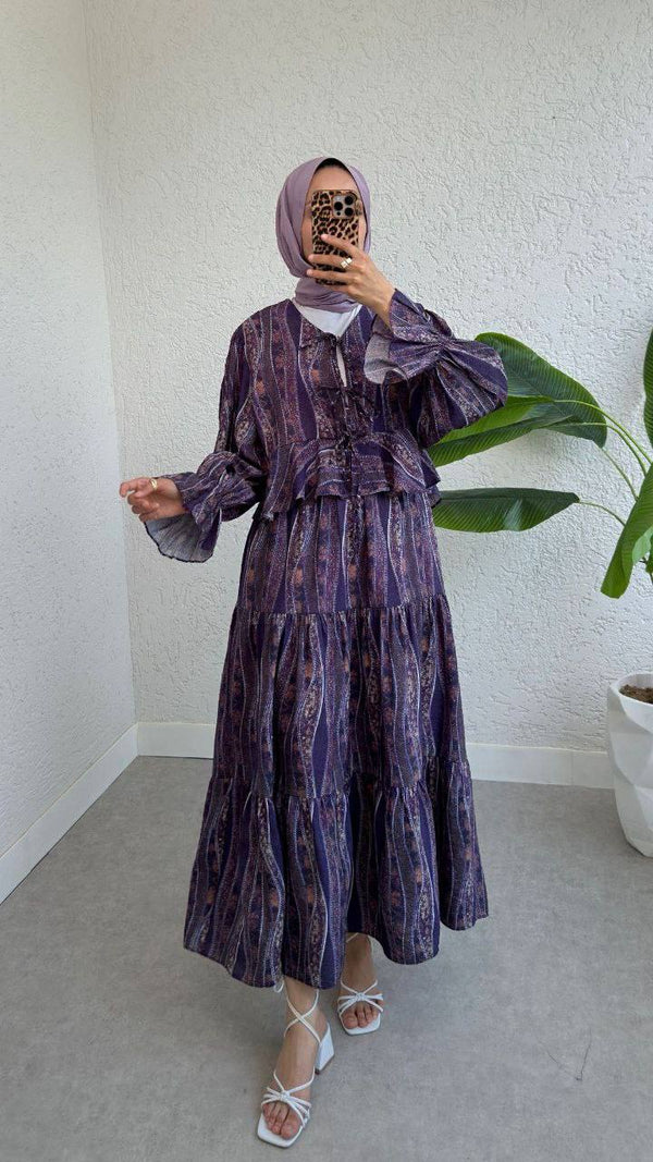 "An elegant, modest dress perfect for hijabis. Flowy, full-length design with soft fabric and a graceful touch."