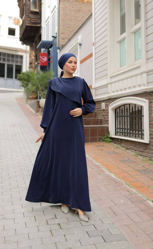 "An elegant, modest dress perfect for hijabis. Flowy, full-length design with soft fabric and a graceful touch."