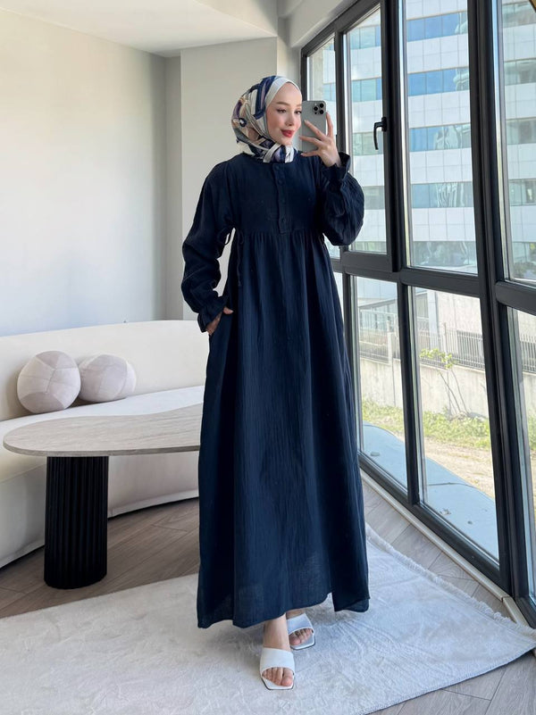 "An elegant, modest dress perfect for hijabis. Flowy, full-length design with soft fabric and a graceful touch."